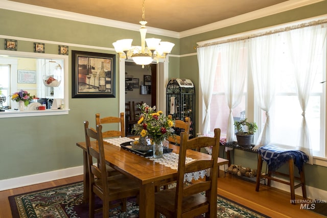 10489 Scotch Pine Rd, Payette, ID 83661 - dining room featuring a chandelier, wood finished floors, and crown molding