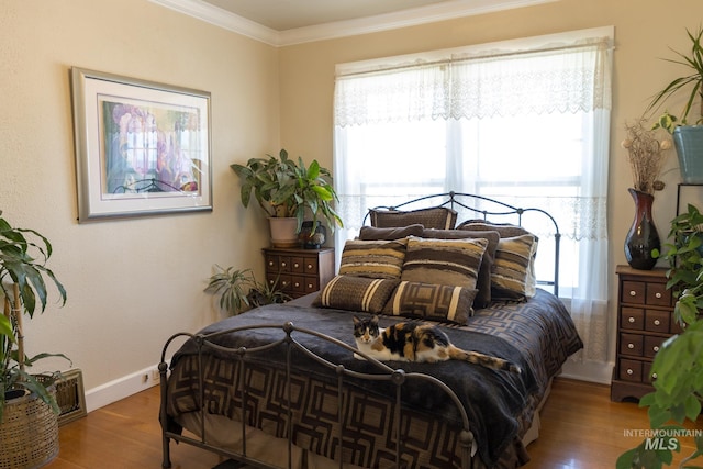 10489 Scotch Pine Rd, Payette, ID 83661 - bedroom featuring wood finished floors and ornamental molding