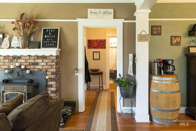 10489 Scotch Pine Rd, Payette, ID 83661 - living area featuring wood finished floors, ornate columns, and ornamental molding