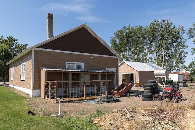 10489 Scotch Pine Rd, Payette, ID 83661 - back of property featuring a chimney and a storage shed