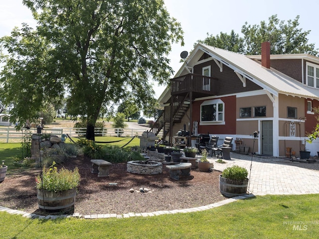 10489 Scotch Pine Rd, Payette, ID 83661 - rear view of property with stairway, a chimney, a patio, and a wooden deck
