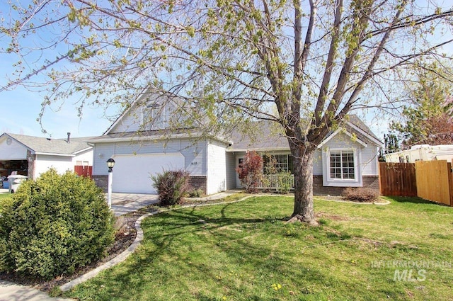 view of front of house featuring a garage, driveway, fence, a front yard, and brick siding