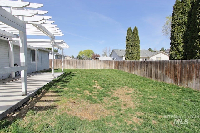 view of yard with a fenced backyard and a pergola