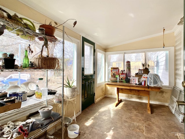 home office with ornamental molding, lofted ceiling, plenty of natural light, and baseboards