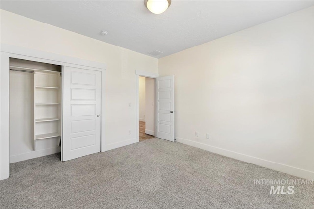 2967 E Diorite St, Nampa, ID 83686 - unfurnished bedroom featuring carpet flooring, baseboards, and a closet