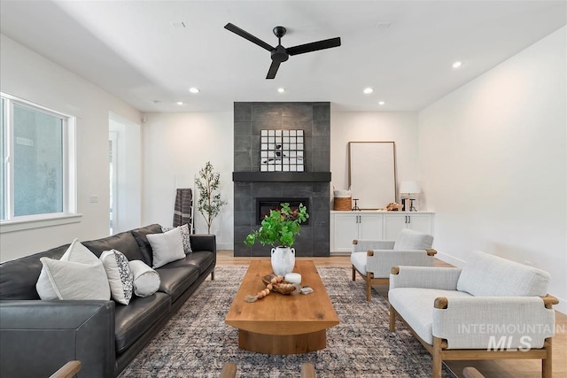 124 S Eagles Roost Way, Eagle, ID 83616 - living area with ceiling fan, recessed lighting, a fireplace, and light wood-type flooring
