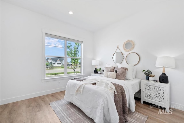 124 S Eagles Roost Way, Eagle, ID 83616 - bedroom with light wood-style flooring