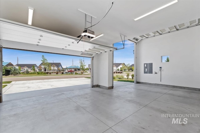 124 S Eagles Roost Way, Eagle, ID 83616 - garage with a garage door opener, a residential view, and electric panel