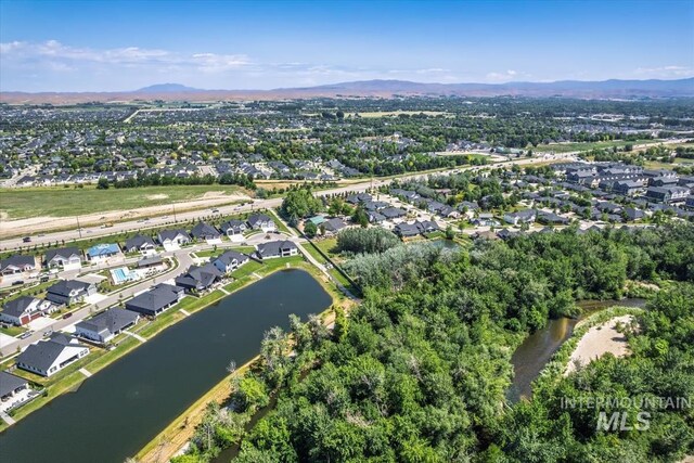 124 S Eagles Roost Way, Eagle, ID 83616 - aerial overview of property's location with nearby suburban area and a water and mountain view