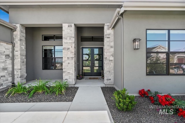 124 S Eagles Roost Way, Eagle, ID 83616 - entrance to property with french doors, stucco siding, and stone siding