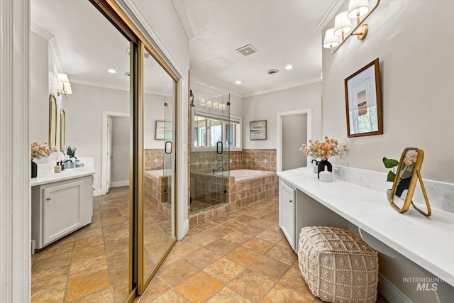 bathroom featuring stone tile floors, a bath, crown molding, a stall shower, and vanity