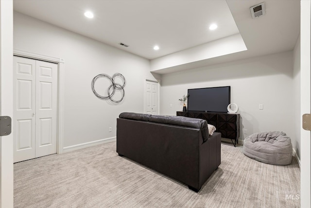 living area featuring carpet, baseboards, and recessed lighting