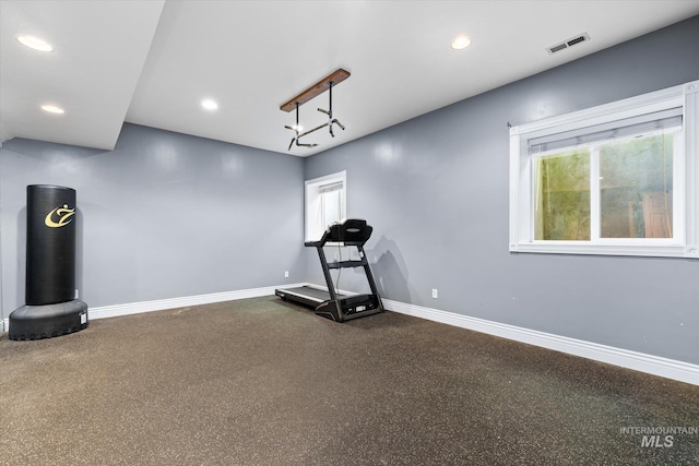 workout room featuring healthy amount of natural light, baseboards, and recessed lighting