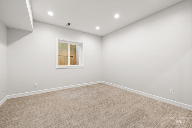 carpeted empty room with recessed lighting and baseboards