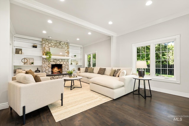 living area featuring crown molding, recessed lighting, a fireplace, dark wood-style floors, and baseboards