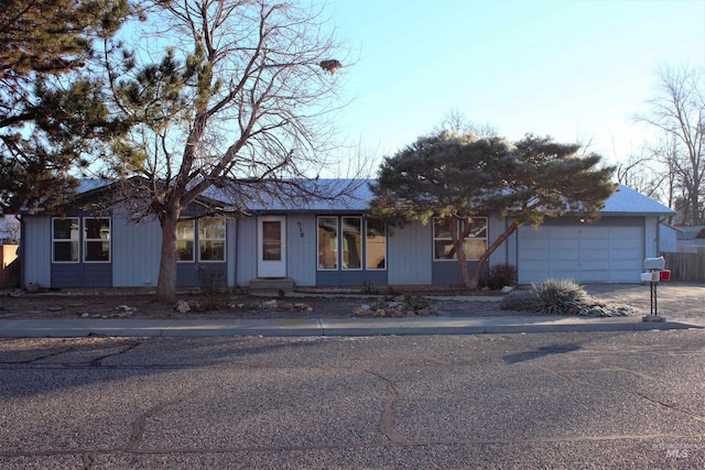 ranch-style home featuring a garage