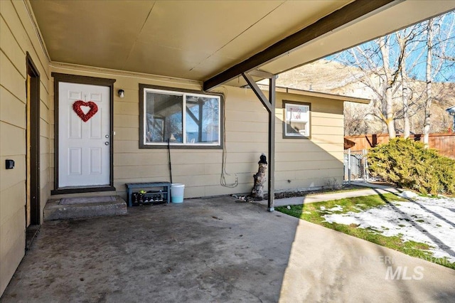 doorway to property with a patio area