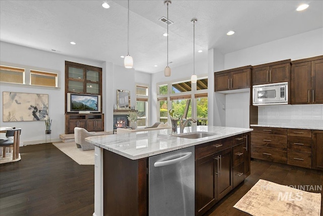 1337 E Lone Shore Dr, Eagle, ID 83616 - kitchen with a sink, stainless steel appliances, recessed lighting, a center island with sink, and open floor plan