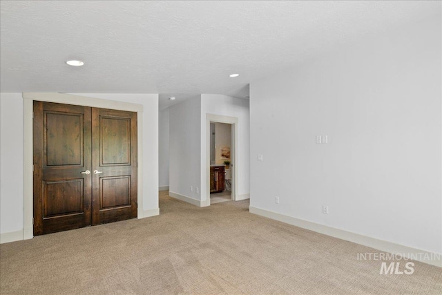 1337 E Lone Shore Dr, Eagle, ID 83616 - unfurnished bedroom featuring light carpet, recessed lighting, and baseboards