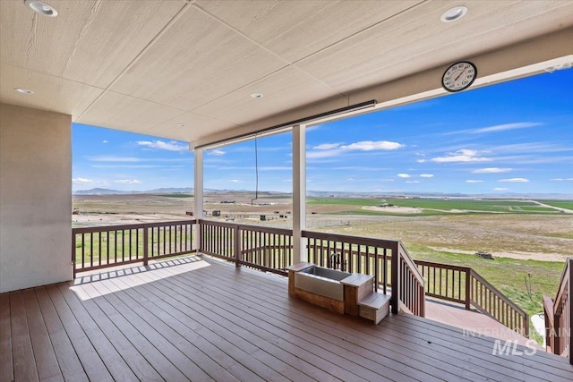 wooden deck with a mountain view