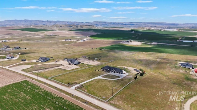 birds eye view of property featuring a mountain view