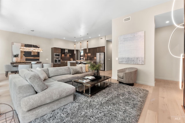 119 S 10th Unit 605, Boise, ID 83702 - living area featuring light wood finished floors and recessed lighting