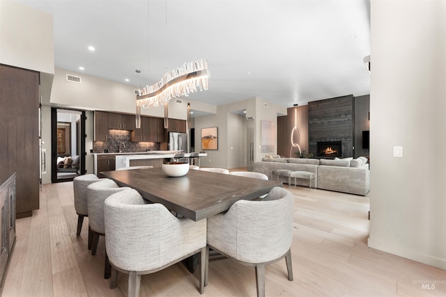 119 S 10th Unit 605, Boise, ID 83702 - dining area with light wood-type flooring and a fireplace