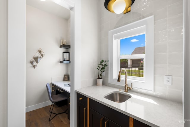 5720 W Little Feather St, Eagle, ID 83616 - kitchen featuring a sink, dark wood-type flooring, light countertops, and dark cabinets