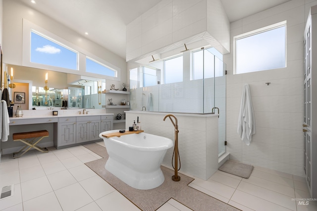 5720 W Little Feather St, Eagle, ID 83616 - bathroom featuring a shower stall, vanity, a freestanding tub, and tile patterned floors