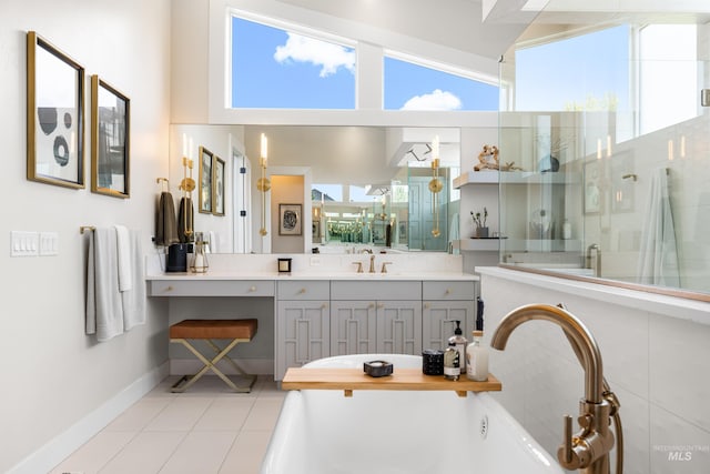 5720 W Little Feather St, Eagle, ID 83616 - bathroom featuring a shower stall, vanity, tile patterned flooring, a bathtub, and baseboards