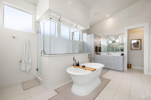 5720 W Little Feather St, Eagle, ID 83616 - bathroom with a stall shower, vanity, a freestanding bath, and tile patterned flooring