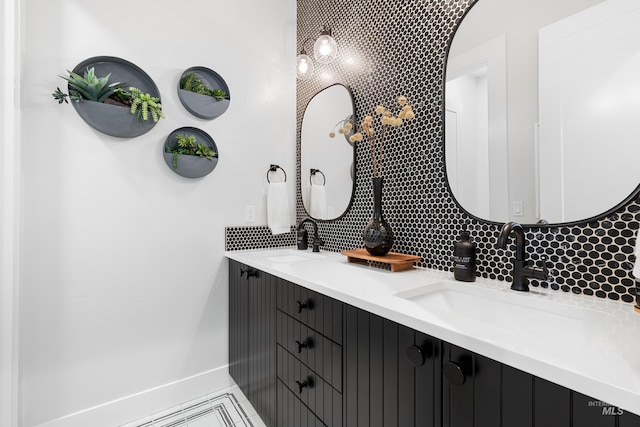 5720 W Little Feather St, Eagle, ID 83616 - bathroom with decorative backsplash, double vanity, and baseboards