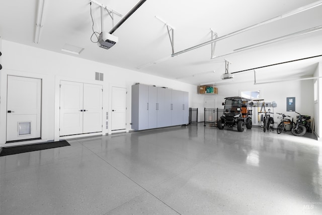 5720 W Little Feather St, Eagle, ID 83616 - garage with electric panel and a garage door opener