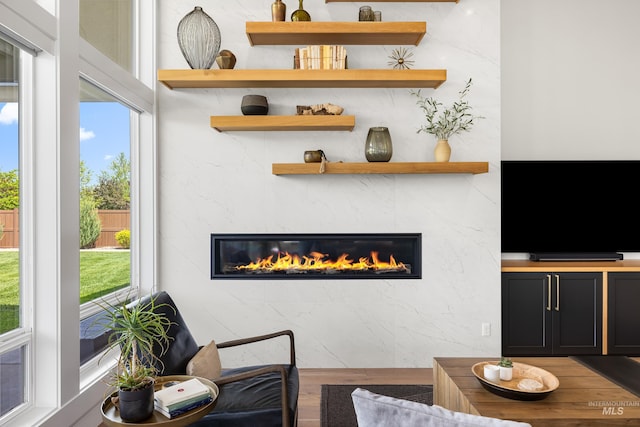 5720 W Little Feather St, Eagle, ID 83616 - living area featuring a premium fireplace and wood finished floors