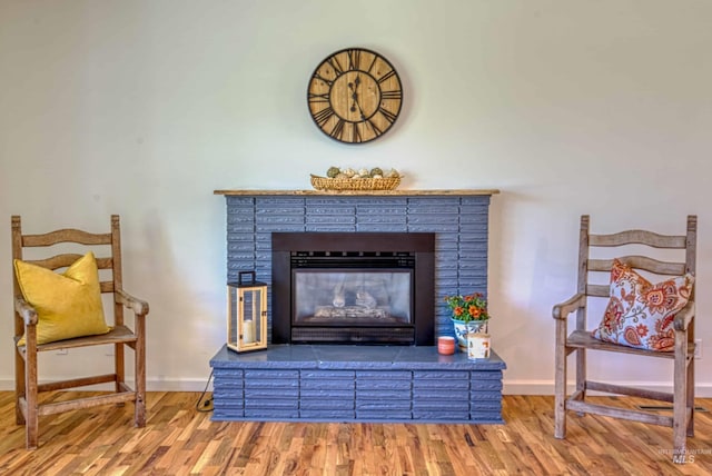 413 S Minnesota Ave, Fruitland, ID 83619 - detailed view of wood finished floors and a brick fireplace