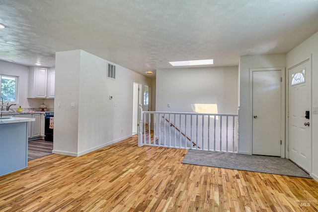 413 S Minnesota Ave, Fruitland, ID 83619 - foyer entrance featuring light wood-style floors and a skylight