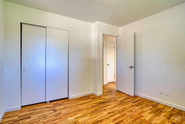 413 S Minnesota Ave, Fruitland, ID 83619 - unfurnished bedroom with light wood-style floors and a closet