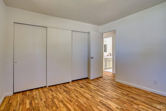 413 S Minnesota Ave, Fruitland, ID 83619 - unfurnished bedroom with light wood-style floors and a closet