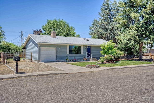 413 S Minnesota Ave, Fruitland, ID 83619 - ranch-style home featuring an attached garage, a chimney, and driveway