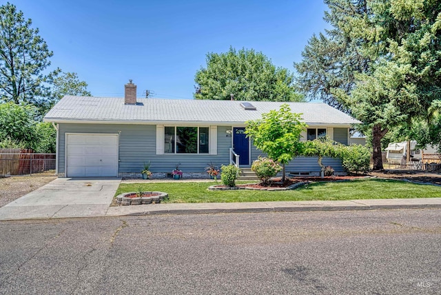 413 S Minnesota Ave, Fruitland, ID 83619 - ranch-style house featuring an attached garage, a chimney, and concrete driveway