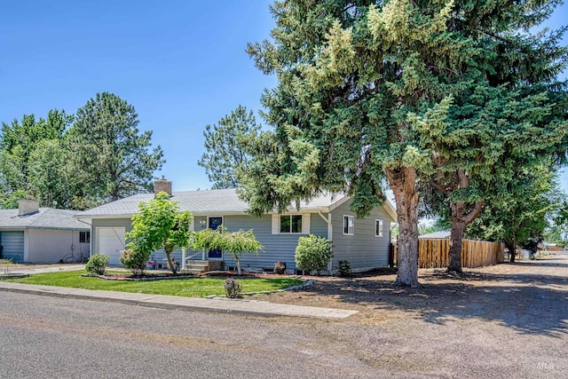 413 S Minnesota Ave, Fruitland, ID 83619 - single story home with an attached garage and a chimney