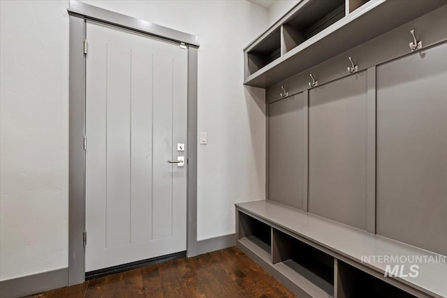 mudroom with dark hardwood / wood-style floors