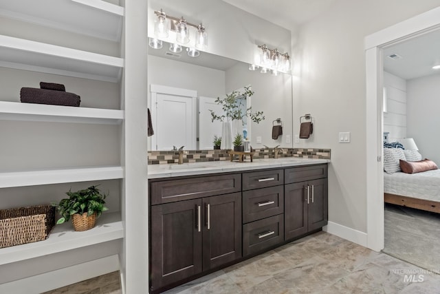 1753 E Grayson, Meridian, ID 83642 - full bathroom featuring double vanity, ensuite bathroom, tasteful backsplash, and baseboards