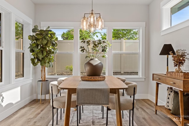 1753 E Grayson, Meridian, ID 83642 - dining room with light wood-style floors, baseboards, and a chandelier