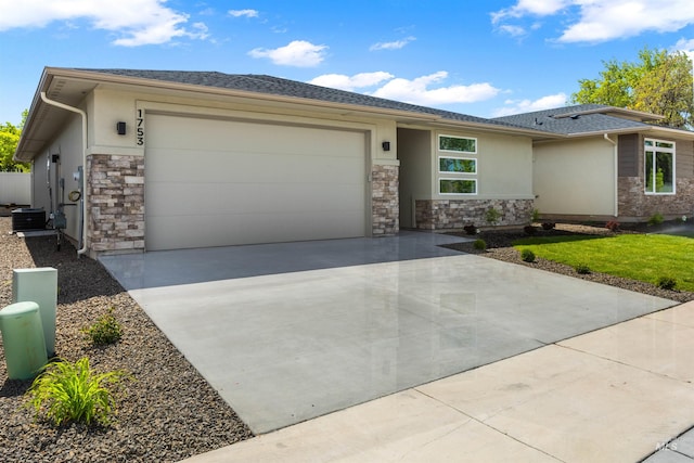 1753 E Grayson, Meridian, ID 83642 - prairie-style home featuring stone siding, driveway, an attached garage, and stucco siding