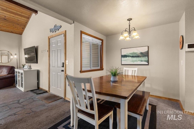 502 Lake Cascade Pkwy Unit 6, Cascade, ID 83611 - dining room with dark colored carpet, a chandelier, and baseboards