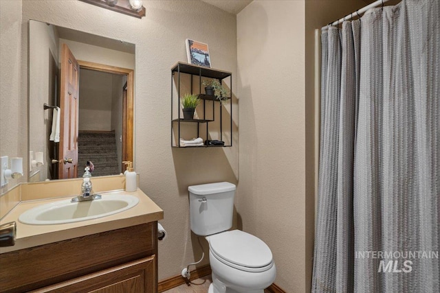 502 Lake Cascade Pkwy Unit 6, Cascade, ID 83611 - bathroom with vanity, toilet, a textured wall, baseboards, and a shower with curtain