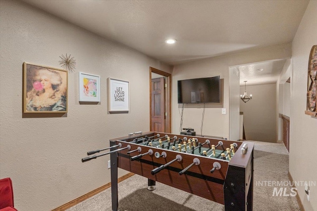 502 Lake Cascade Pkwy Unit 6, Cascade, ID 83611 - rec room featuring carpet floors, a textured wall, baseboards, a chandelier, and recessed lighting
