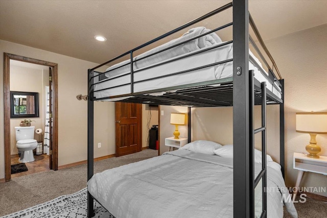 502 Lake Cascade Pkwy Unit 6, Cascade, ID 83611 - carpeted bedroom with baseboards, connected bathroom, and recessed lighting