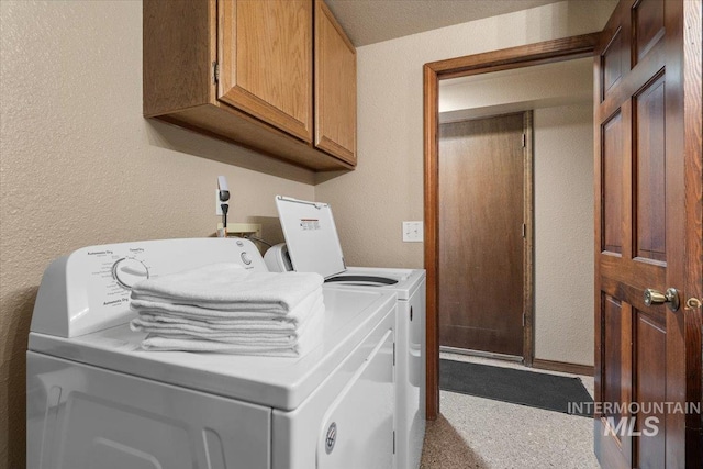 502 Lake Cascade Pkwy Unit 6, Cascade, ID 83611 - laundry area featuring cabinet space, independent washer and dryer, and a textured wall